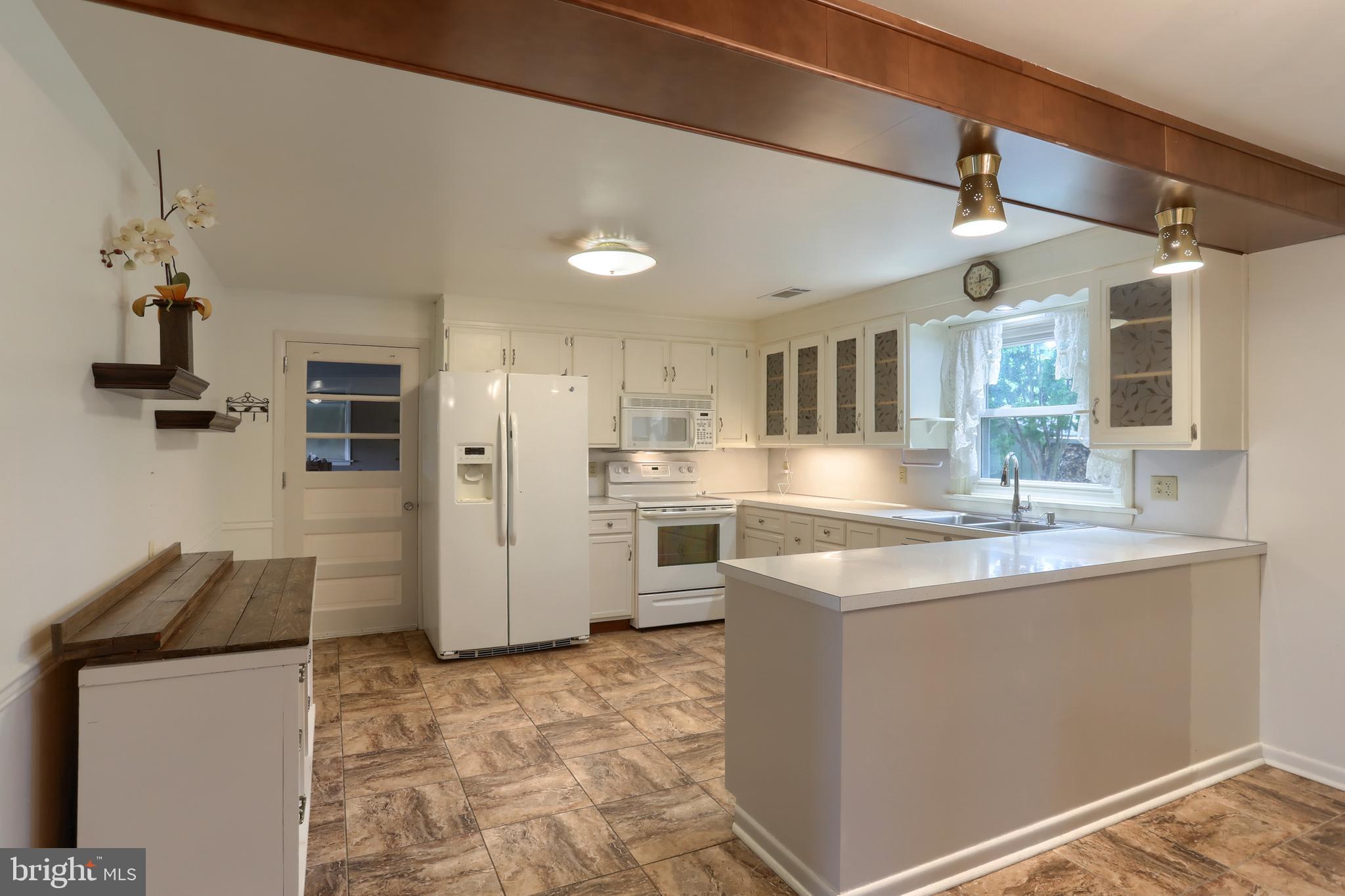 2040 Miller Road East Petersburg, PA 17520 - Photo 5 of 49 a kitchen with stainless steel appliances granite countertop a sink and refrigerator