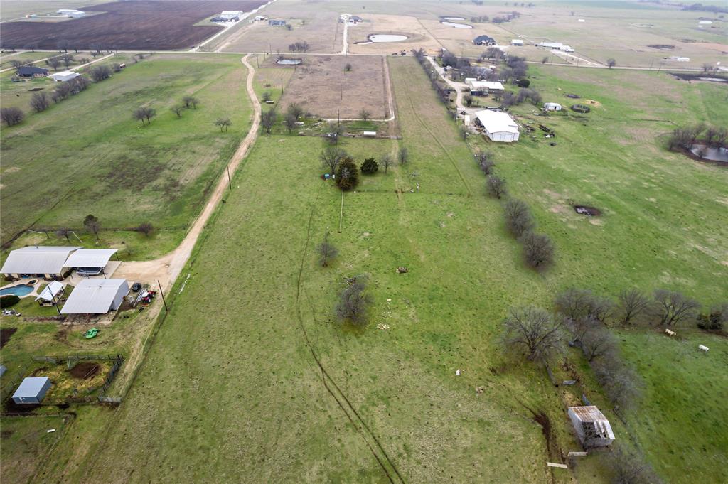 2209 County Road 332 Era, TX 76238 - Photo 4 of 6 an aerial view of residential houses with outdoor space