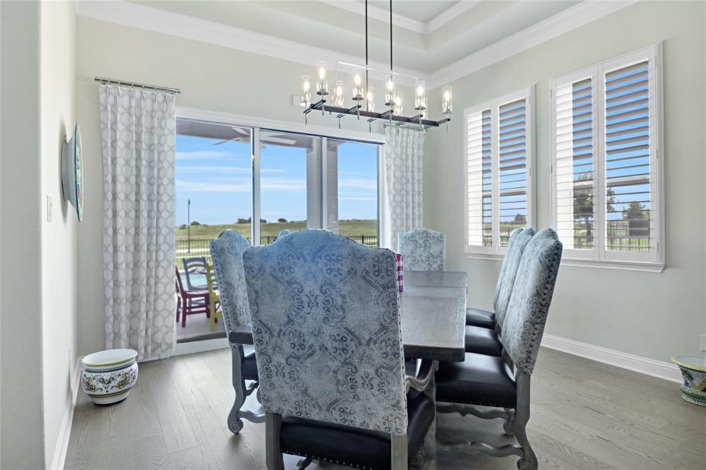 1809 Shade Tree Street Fort Worth, TX 76008 - Photo 8 of 28 Dining with glass doors that open to patio with beautiful views.
