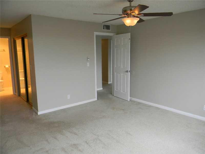 22511 Southwest 66th Avenue, Unit 409 Boca Raton, FL 33428 - Photo 7 of 9 Master Bedroom