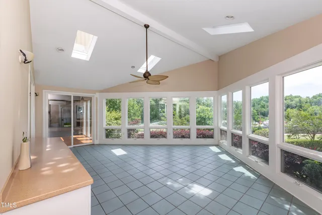 a view of an entryway with a floor to ceiling window