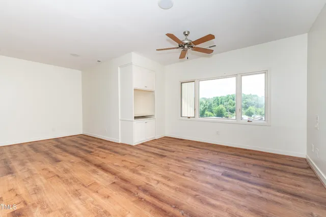 a large bathroom with a large tub sink and window