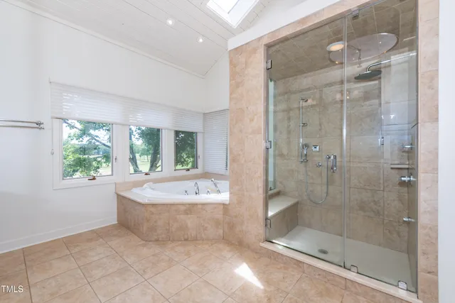 a view of bathroom with a sink and refrigerator
