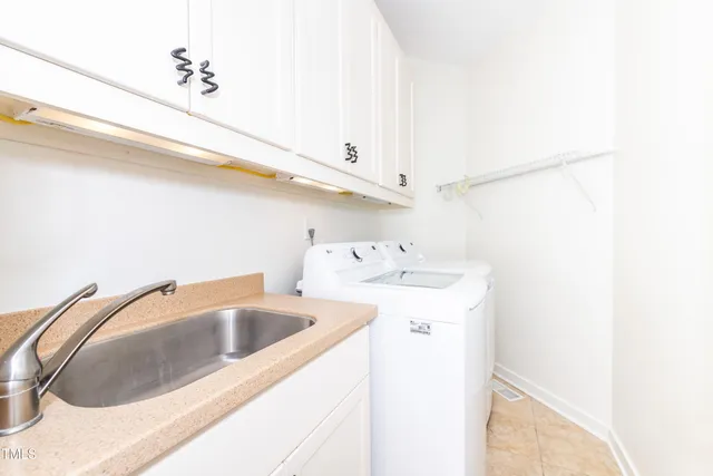 a bathroom with a shower and a window