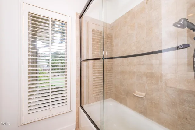 a view of a garden with a building in the background