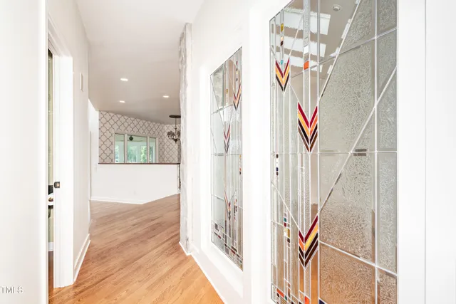 an aerial view of a house with a yard basket ball court and outdoor seating