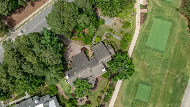 a view of a backyard with plants and a patio