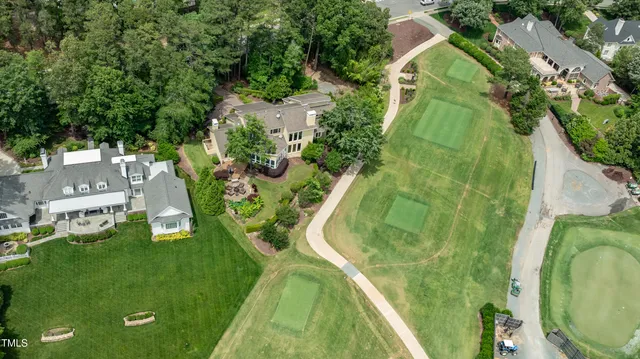 a view of a swimming pool with a yard
