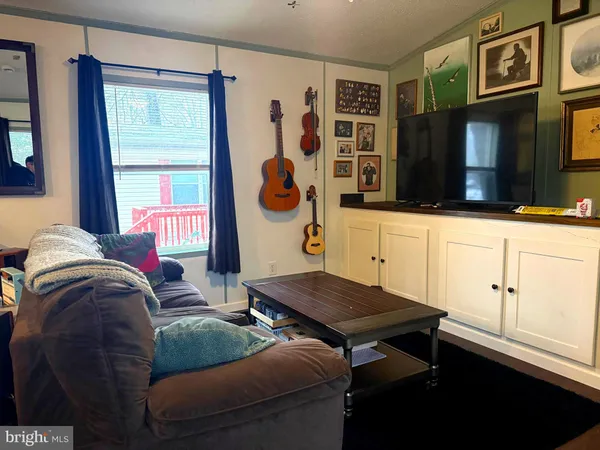 a kitchen with stainless steel appliances granite countertop a stove and a refrigerator