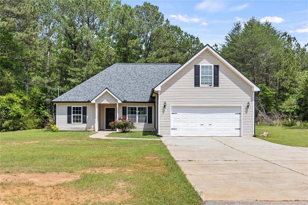 220 Rocky Point Road Covington, GA 30014 - Photo 1 of 1 a view of a house with a yard