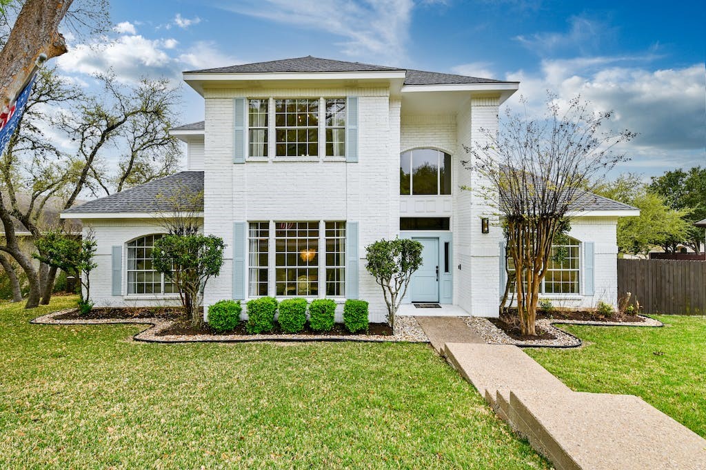 front view of a house with a yard