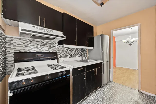 a kitchen with a stove and a cabinets
