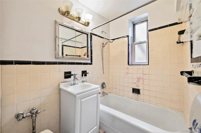 a bathroom with a sink a mirror and a bathtub