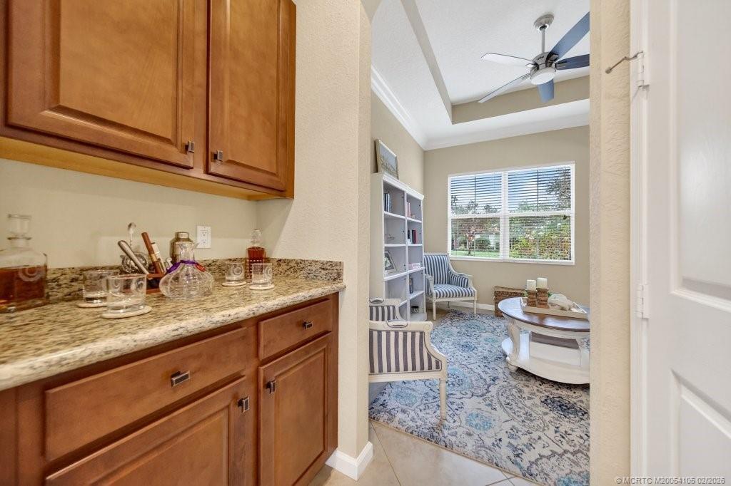 8121 Southwest Marin Drive Stuart, FL 34997 - Photo 15 of 31 a kitchen with a sink and cabinets