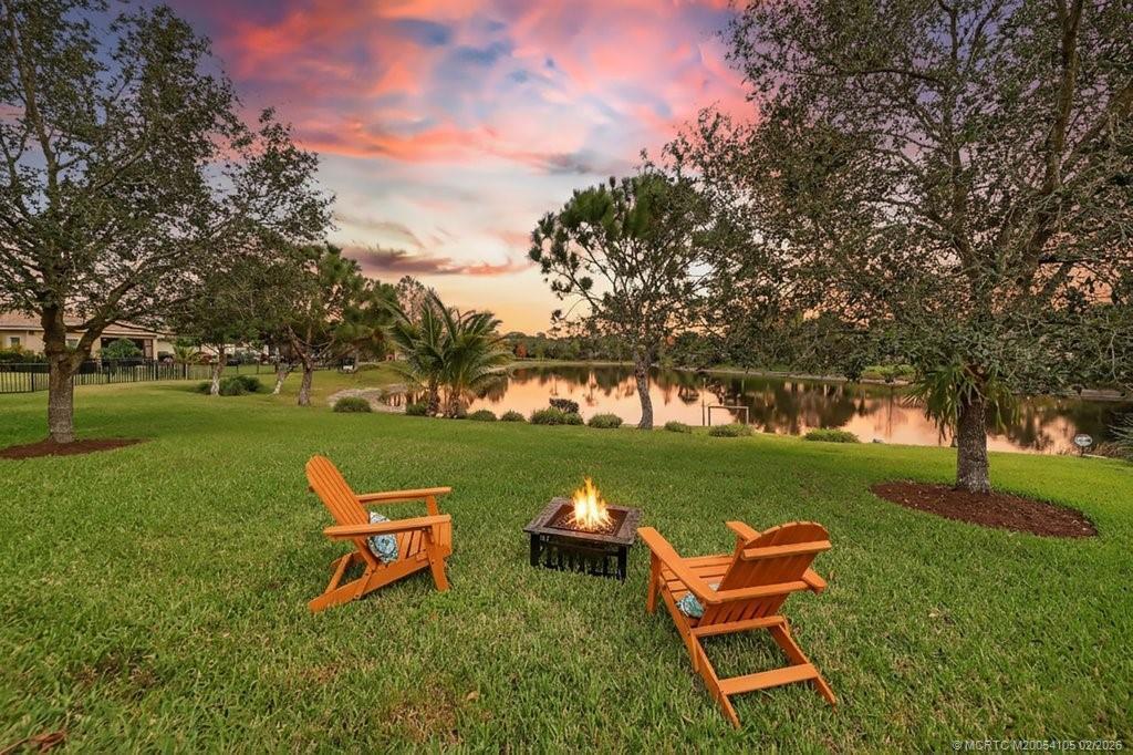 8121 Southwest Marin Drive Stuart, FL 34997 - Photo 2 of 31 a garden view with a sitting space and garden