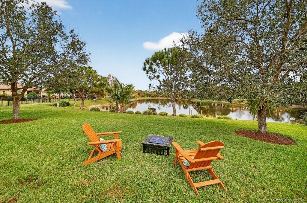 8121 Southwest Marin Drive Stuart, FL 34997 - Photo 28 of 31 a view of a park with bench and trees