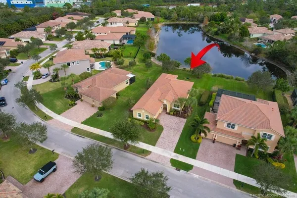 an aerial view of a houses with yard