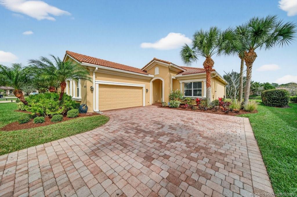 8121 Southwest Marin Drive Stuart, FL 34997 - Photo 4 of 31 a front view of house with yard and green space