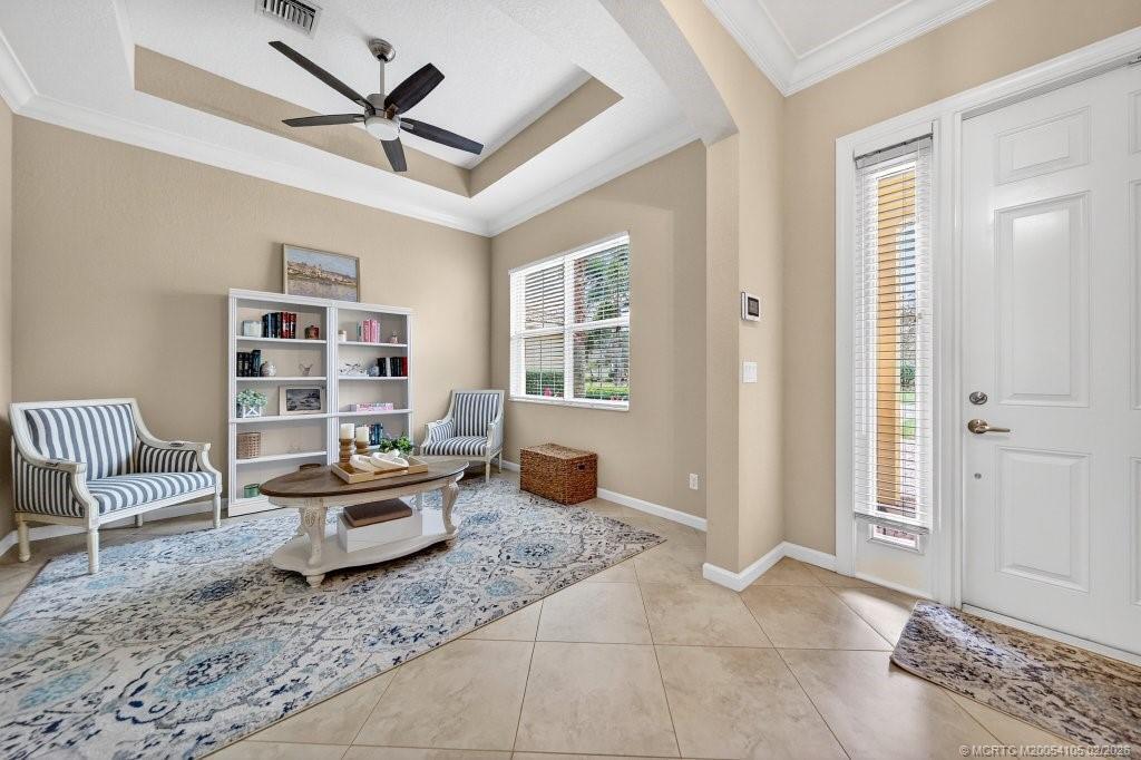 8121 Southwest Marin Drive Stuart, FL 34997 - Photo 6 of 31 a living room with furniture and a window