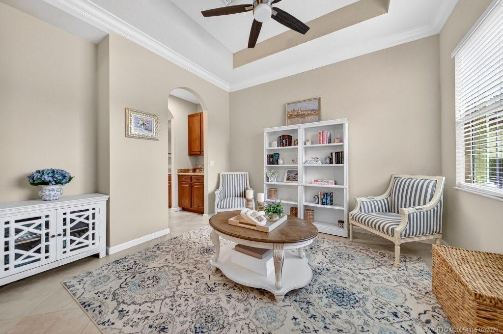 8121 Southwest Marin Drive Stuart, FL 34997 - Photo 7 of 31 a living room with furniture and a rug