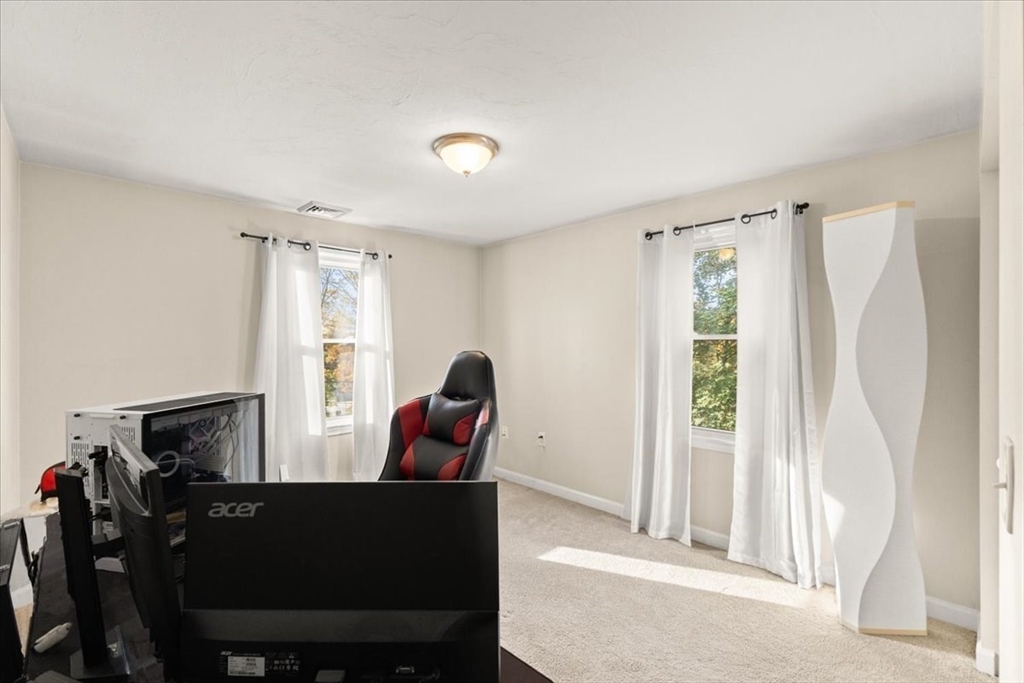 3 Federal Street, Unit 3 Blackstone, MA 01504 - Photo 20 of 27 a living room with furniture and a window