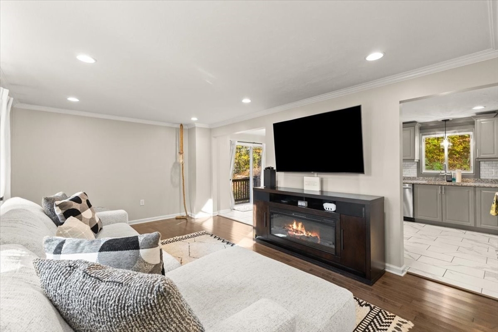 3 Federal Street, Unit 3 Blackstone, MA 01504 - Photo 4 of 27 a living room with furniture and a flat screen tv