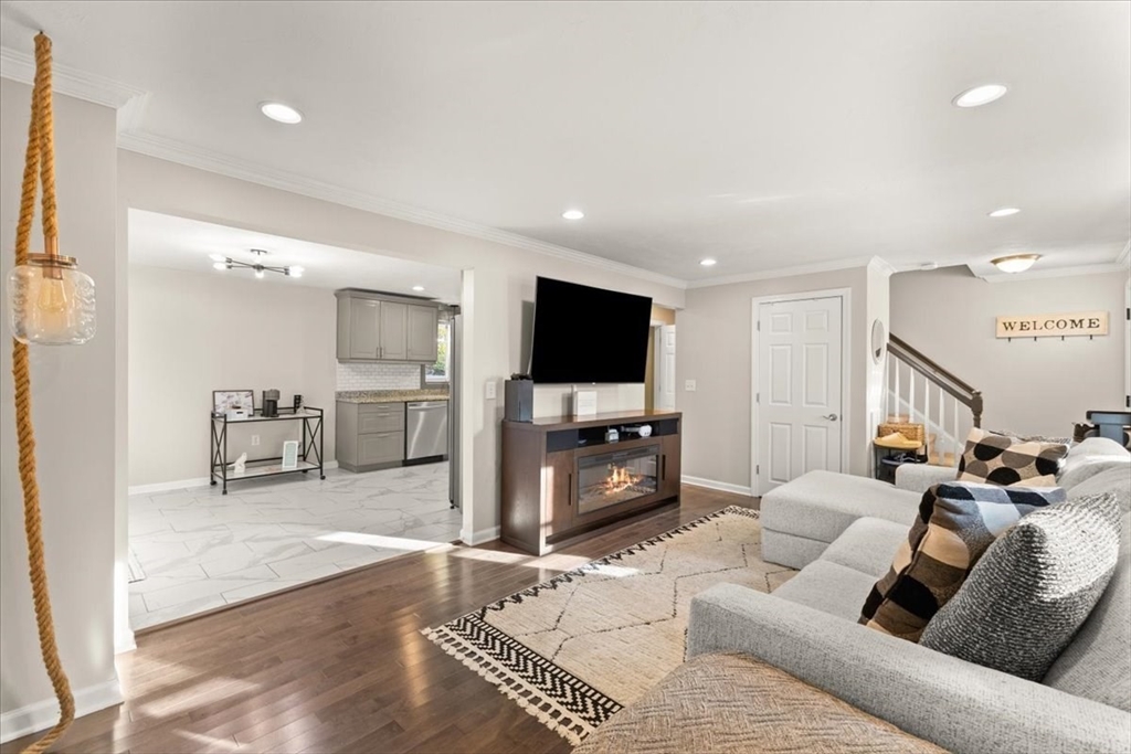 3 Federal Street, Unit 3 Blackstone, MA 01504 - Photo 7 of 27 a living room with furniture and a flat screen tv