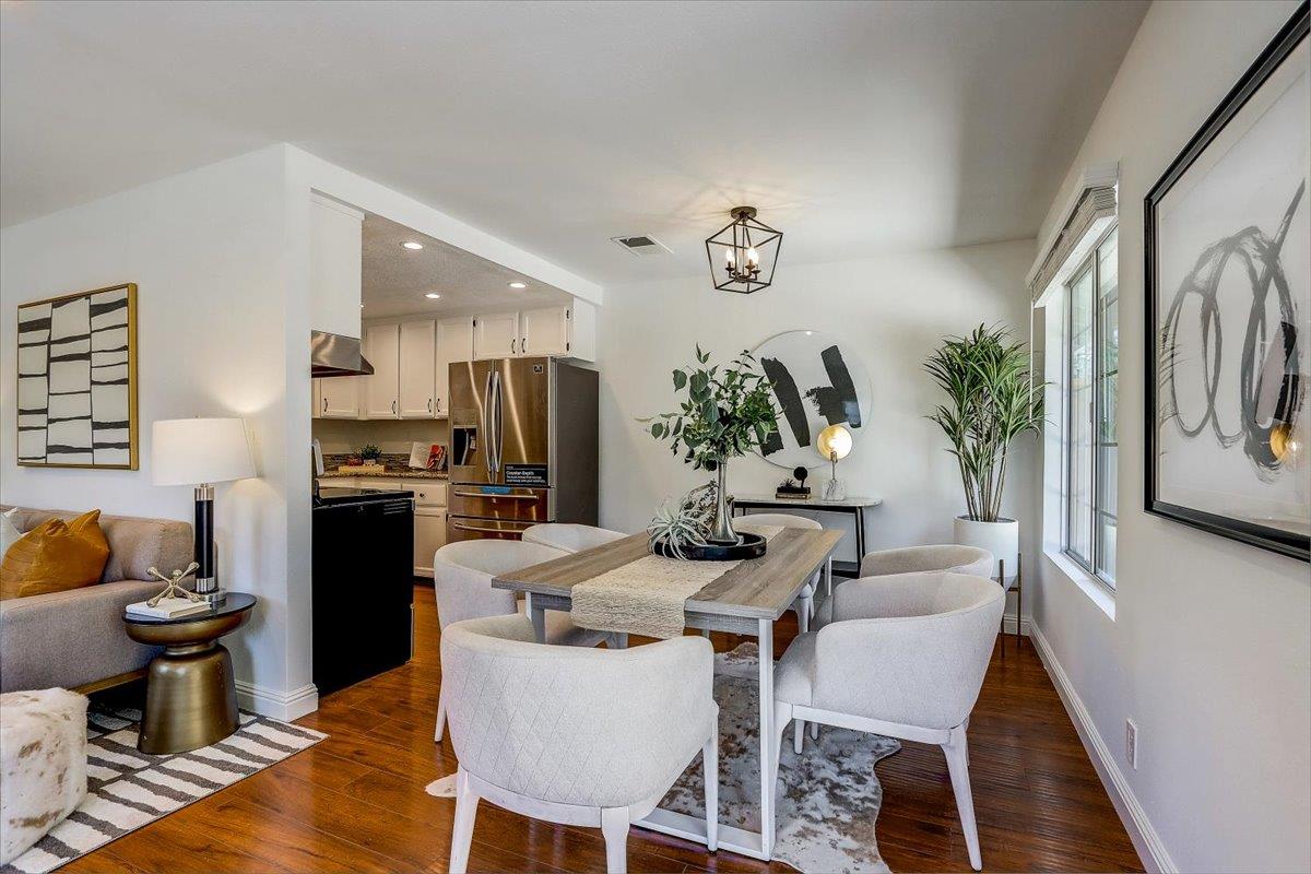 238 Mavis Drive Pleasanton, CA 94566 - Photo 12 of 53 a dining room with furniture a kitchen view and wooden floor