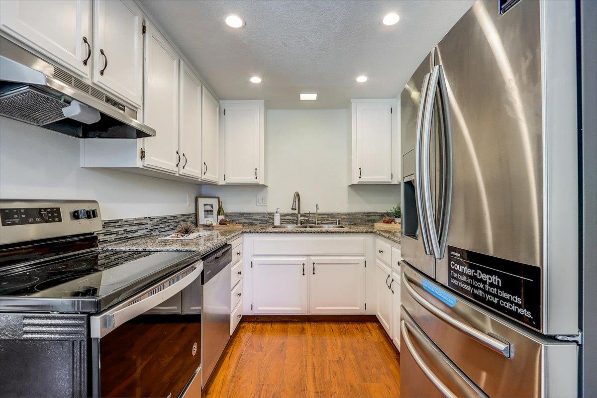 238 Mavis Drive Pleasanton, CA 94566 - Photo 18 of 53 a kitchen with a sink appliances and cabinets
