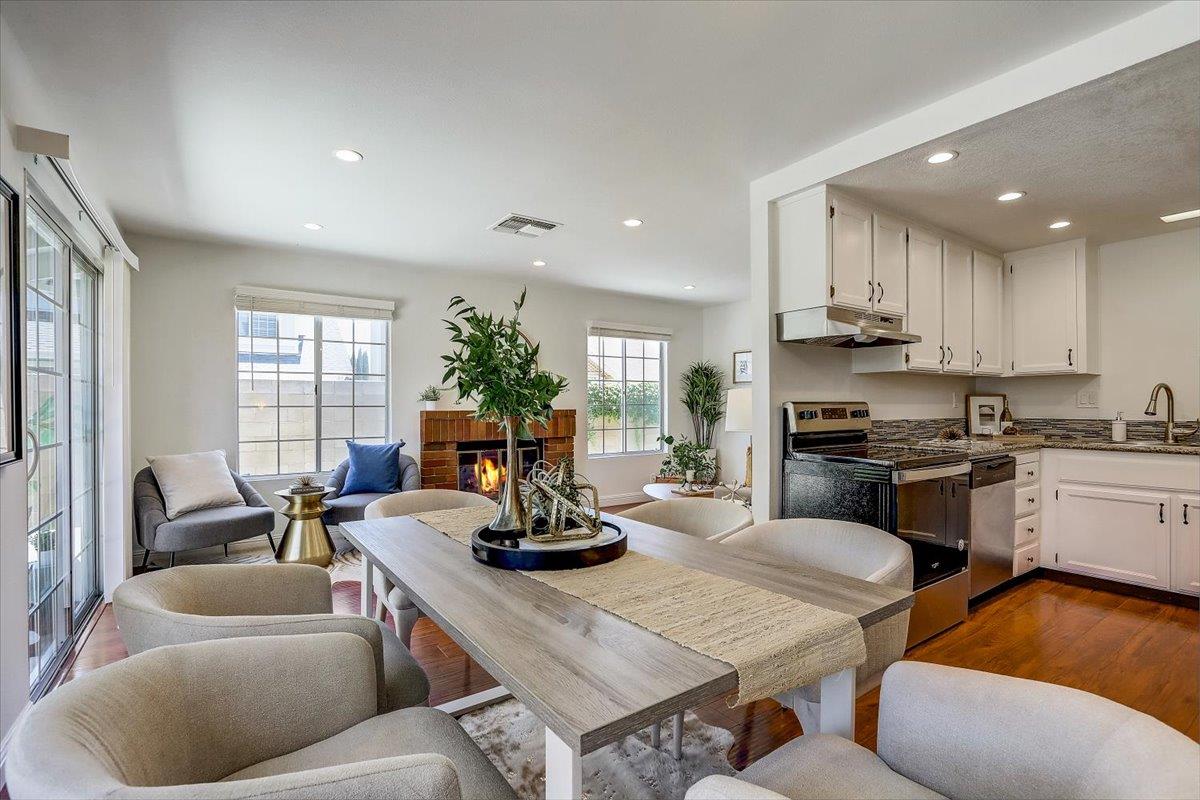 238 Mavis Drive Pleasanton, CA 94566 - Photo 19 of 53 a kitchen with a table chairs stove and kitchen view