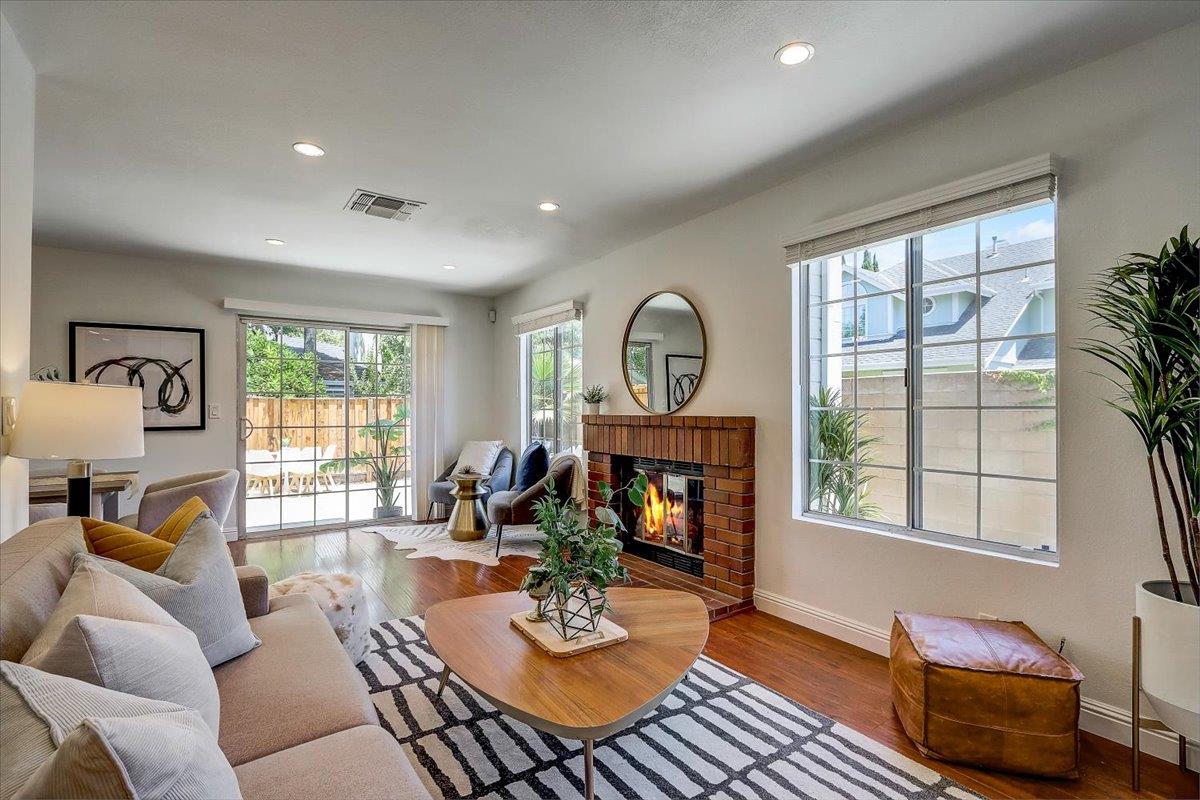 238 Mavis Drive Pleasanton, CA 94566 - Photo 8 of 53 a living room with furniture a fireplace and a window