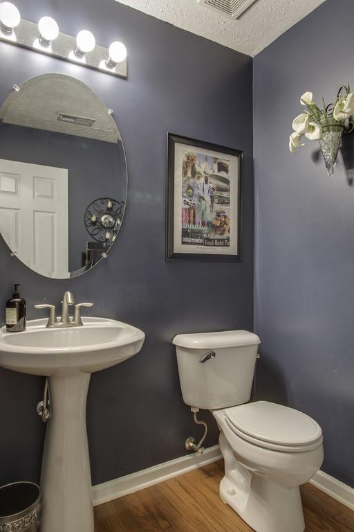 3973 Stephens Ridge Way Antioch, TN 37013 - Photo 11 of 19 a bathroom with a toilet a sink and mirror