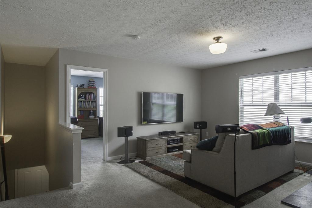 3973 Stephens Ridge Way Antioch, TN 37013 - Photo 13 of 19 a living room with furniture and a flat screen tv