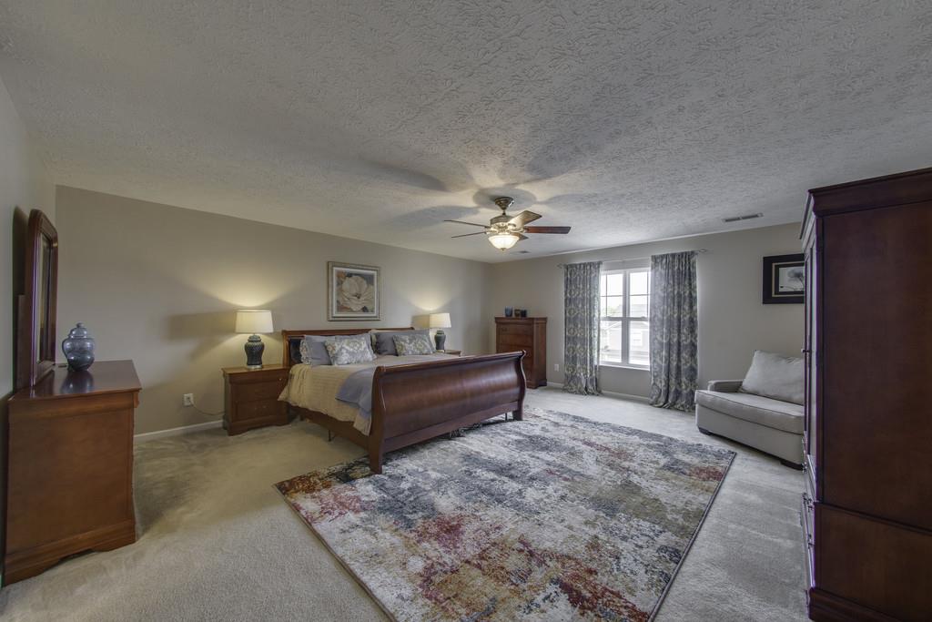 3973 Stephens Ridge Way Antioch, TN 37013 - Photo 14 of 19 a large bedroom with a bed and furniture