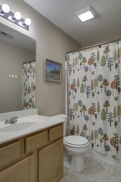 3973 Stephens Ridge Way Antioch, TN 37013 - Photo 17 of 19 a bathroom with a toilet sink and a shower
