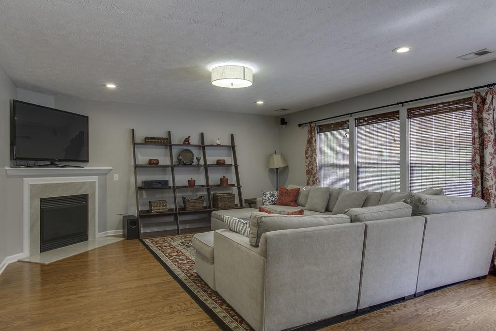 3973 Stephens Ridge Way Antioch, TN 37013 - Photo 8 of 19 a living room with furniture and a flat screen tv