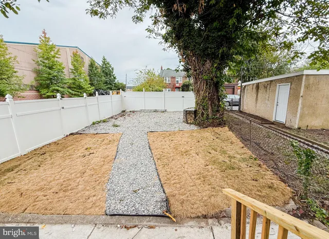 a view of a house with pool and sitting area