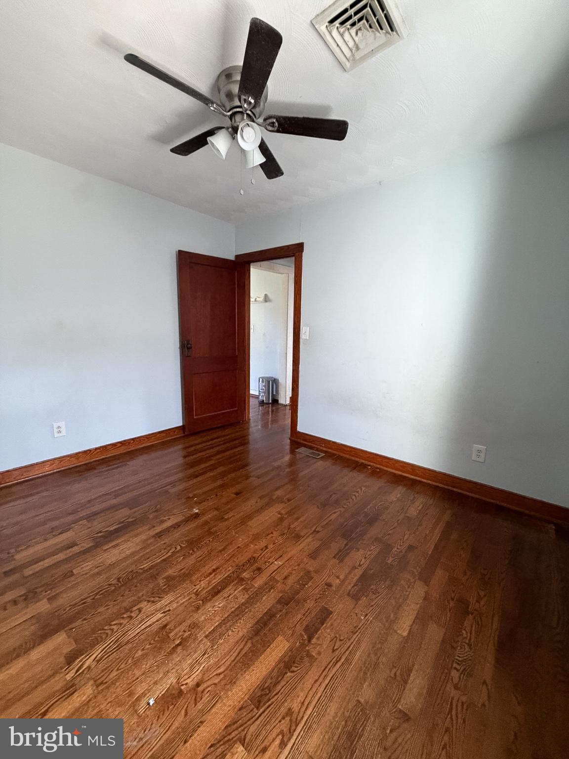 2929 Packer Street Winchester, VA 22601 - Photo 15 of 38 a view of an empty room with a window and wooden floor