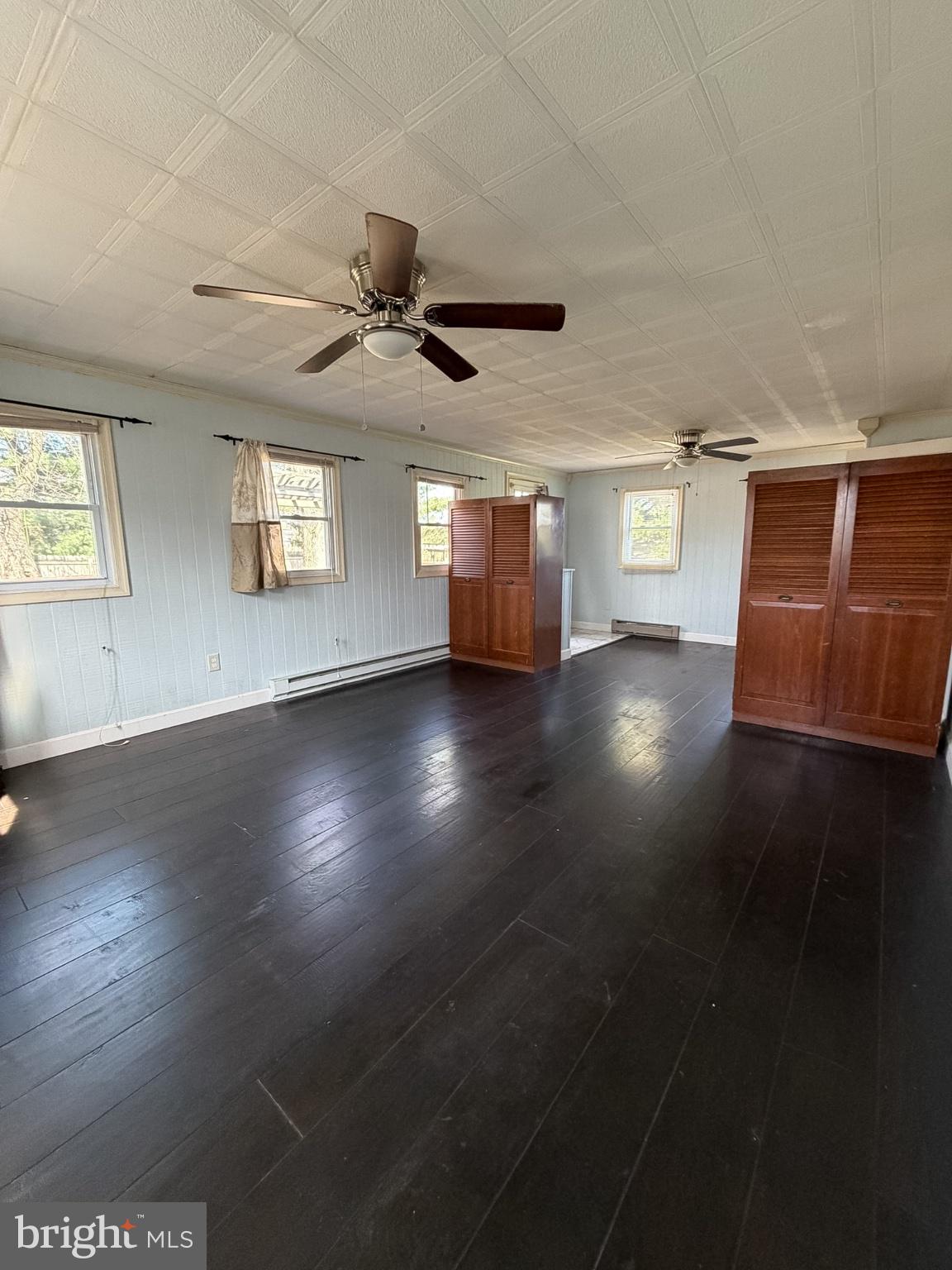 2929 Packer Street Winchester, VA 22601 - Photo 17 of 38 a view of a livingroom with wooden floor and a ceiling fan