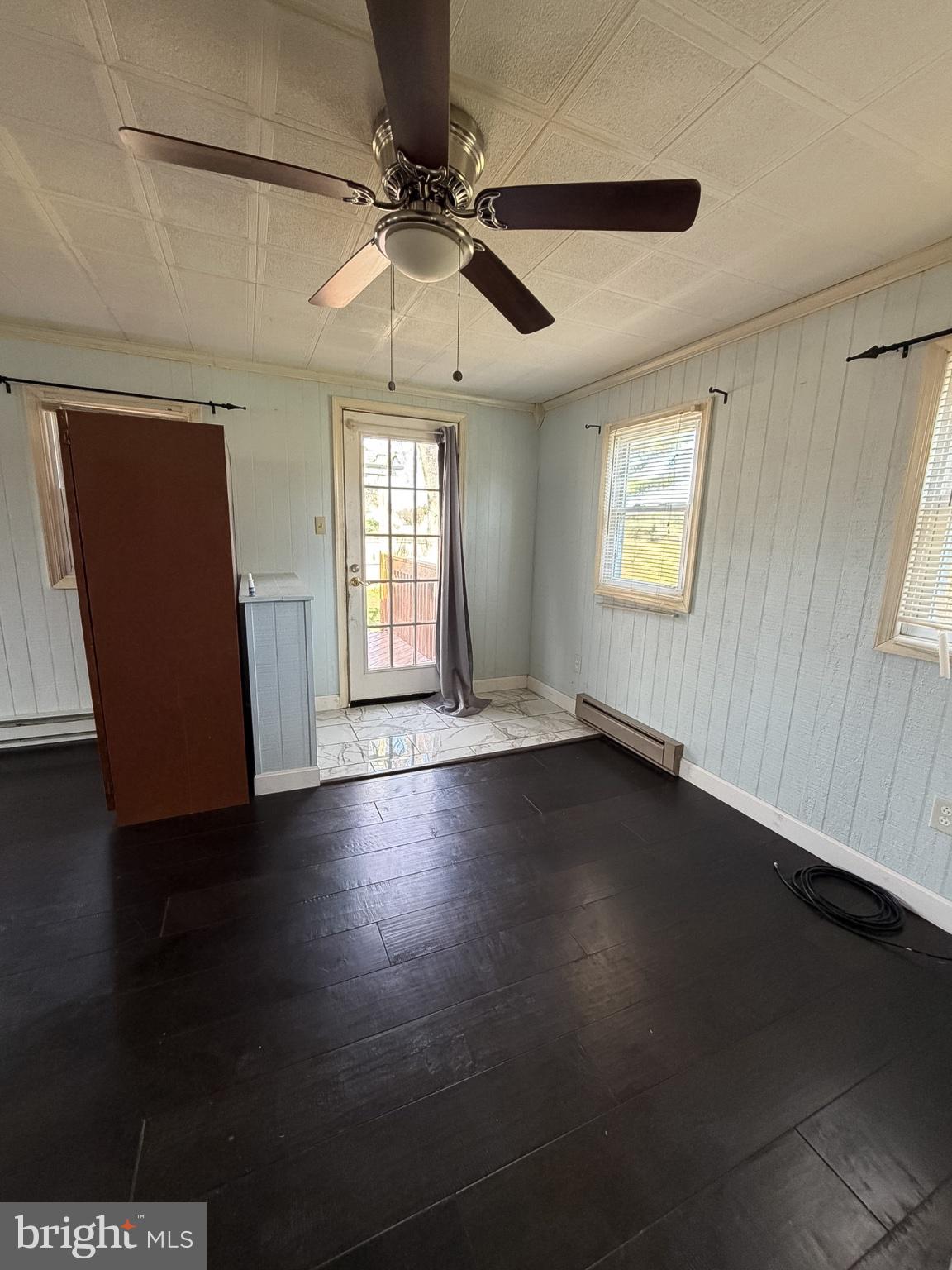 2929 Packer Street Winchester, VA 22601 - Photo 19 of 38 an empty room with wooden floor and windows