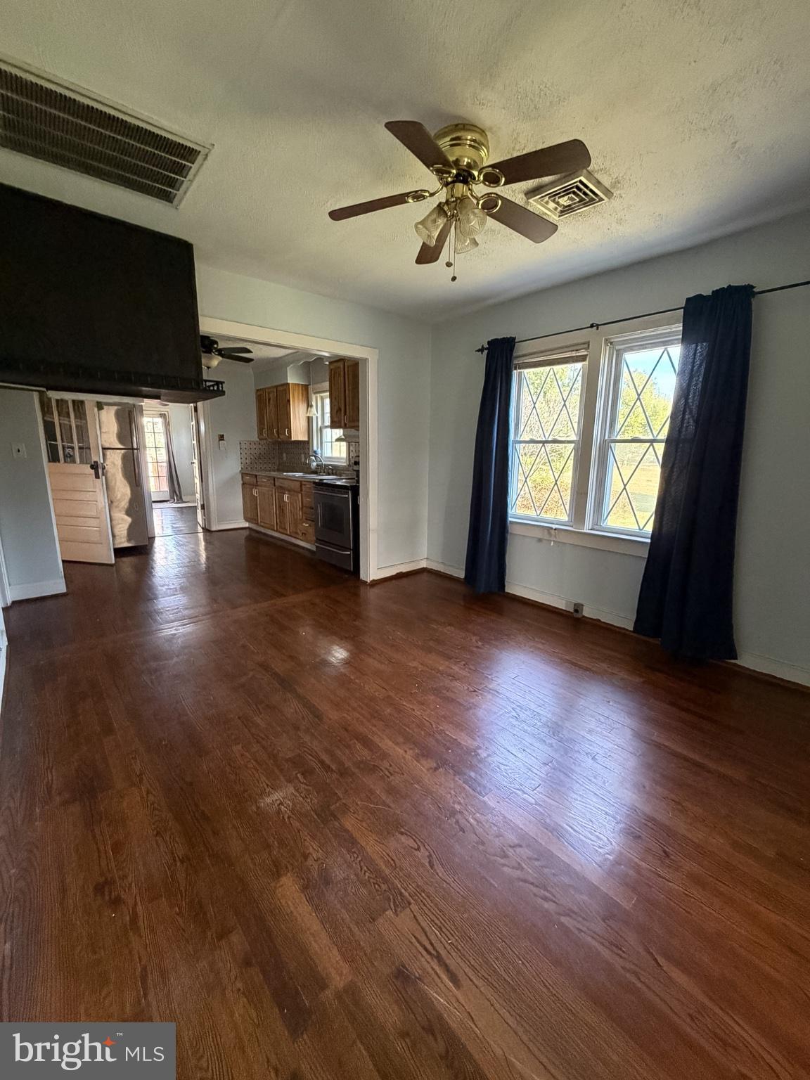 2929 Packer Street Winchester, VA 22601 - Photo 7 of 38 a view of empty room with wooden floor and fan
