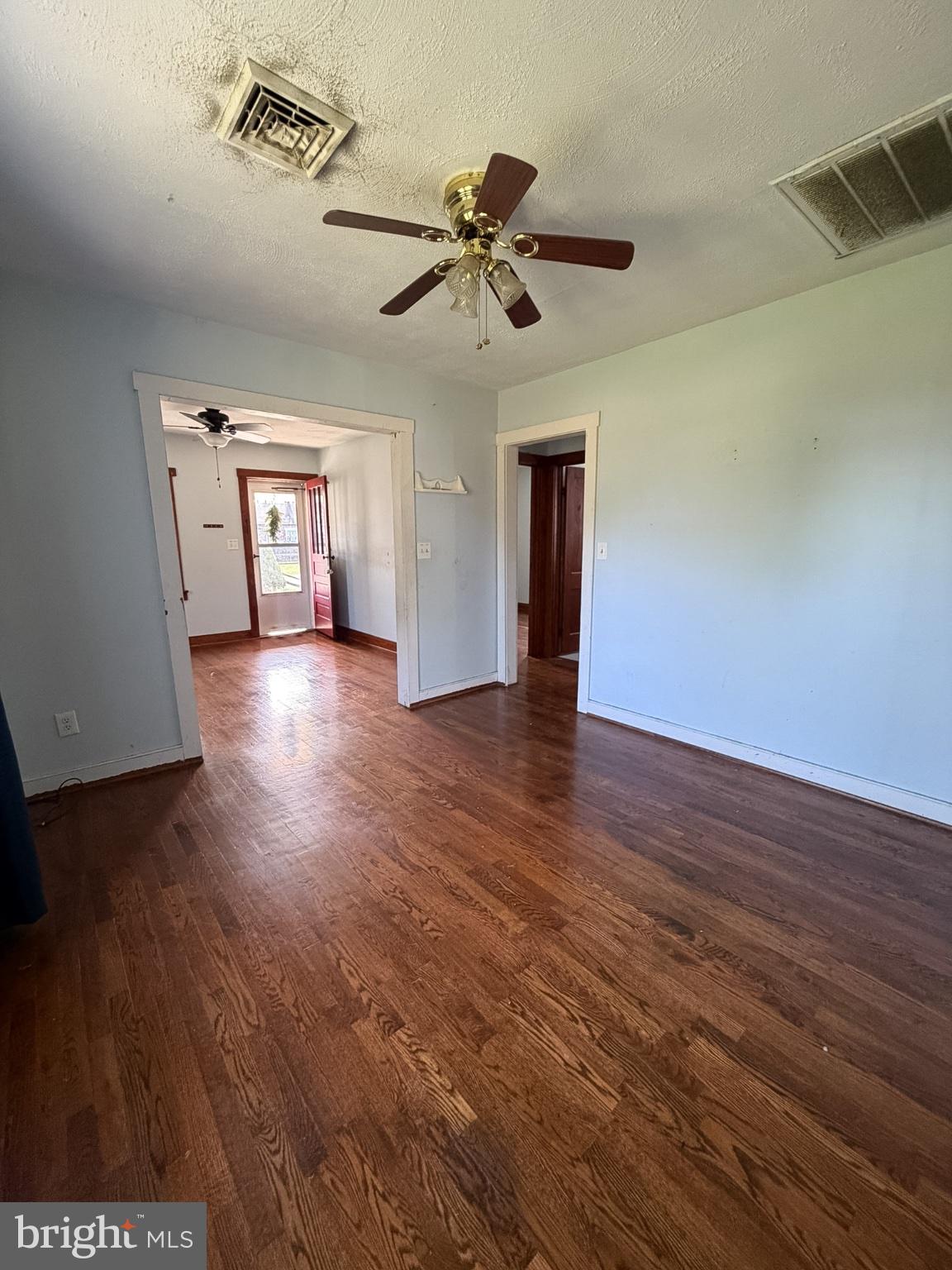 2929 Packer Street Winchester, VA 22601 - Photo 8 of 38 wooden floor in an empty room with a window