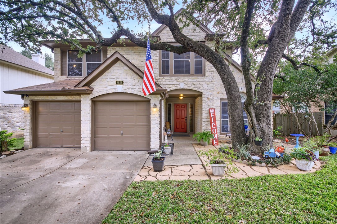 8628 Ephraim Road Austin, TX 78717 - Photo 1 of 1 a front view of a house with a yard and fountain