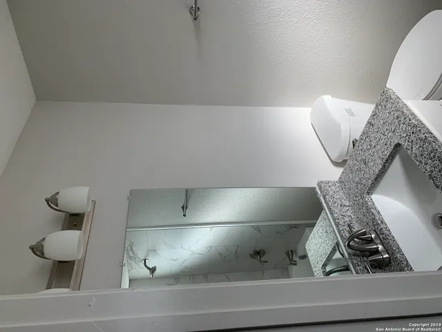 a bathroom with a bathtub and shower