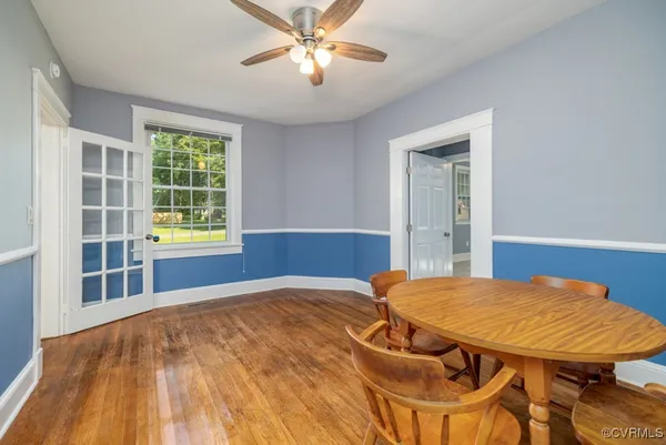 a view of a room with furniture and window