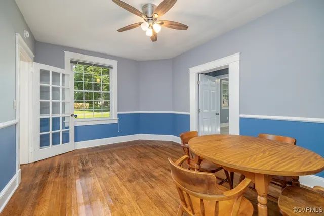 a view of a room with furniture and window