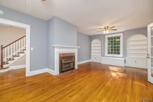 wooden floor fireplace and natural light