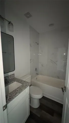 a bathroom with a sink and toilet