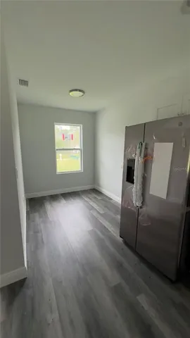 a view of livingroom with hardwood floor and window