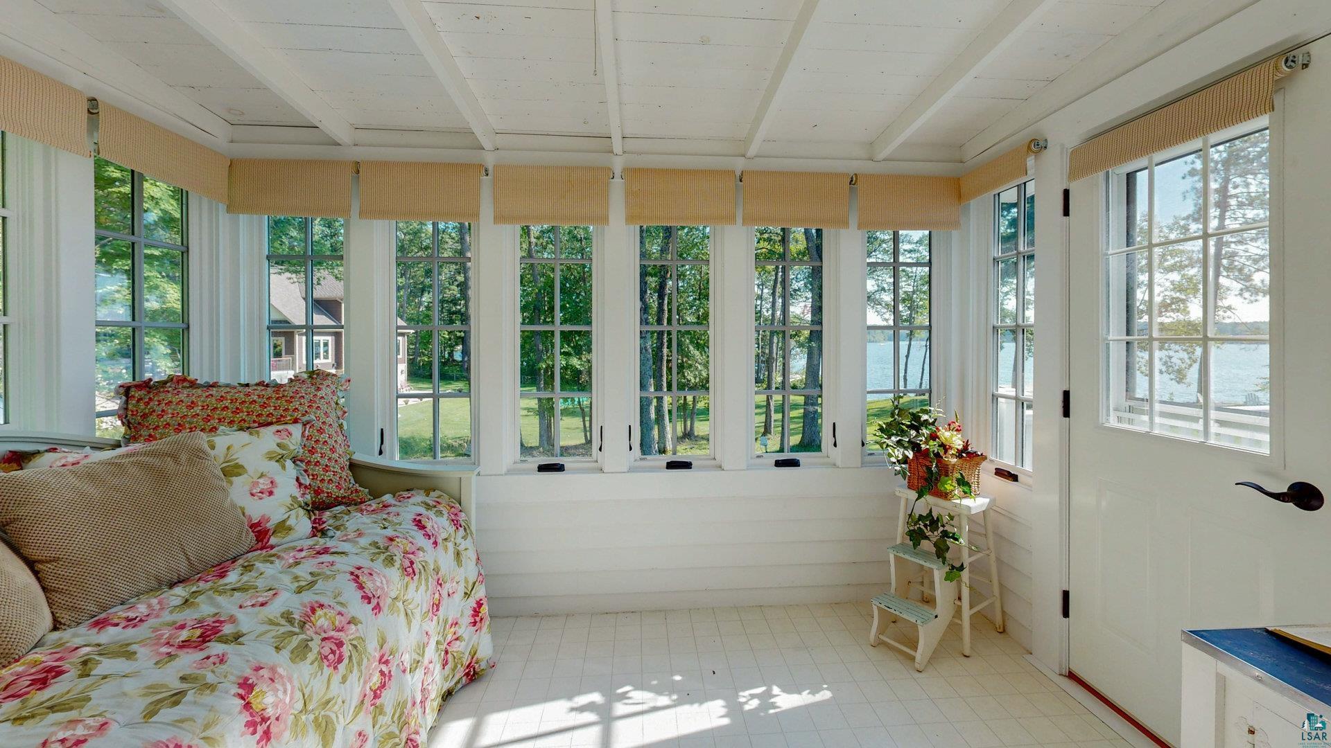 N1211 East Side Road Birchwood, WI 54817 - Photo 60 of 70 Sunroom featuring a wooden ceiling with exposed beams